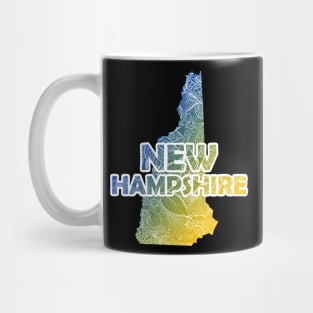 Colorful mandala art map of New Hampshire with text in blue and yellow Mug